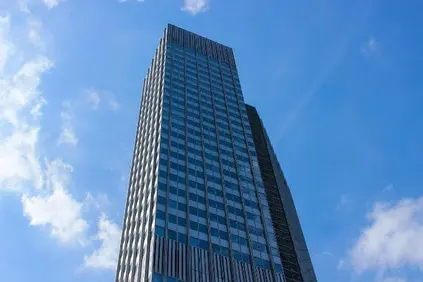 A large building with a blue sky