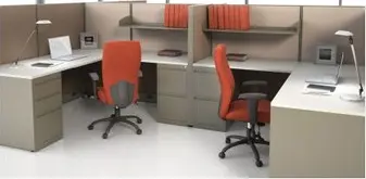 A room with a desk chair and a computer