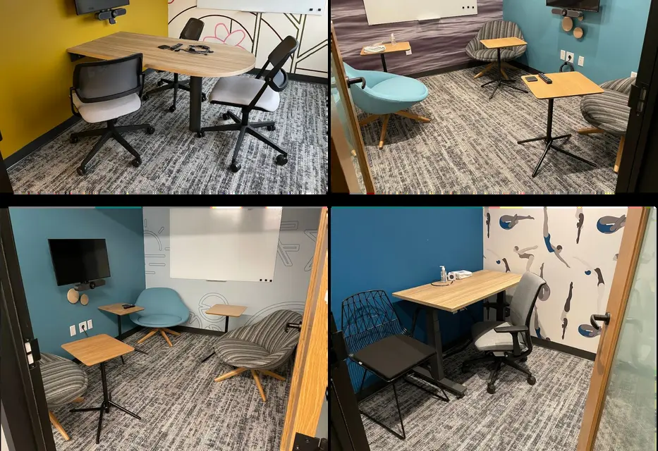 A room with a table chairs and a wall with a wall of picture